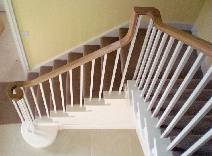 Painted staircase with oak continuous handrail Painted staircase with oak continuous handrail